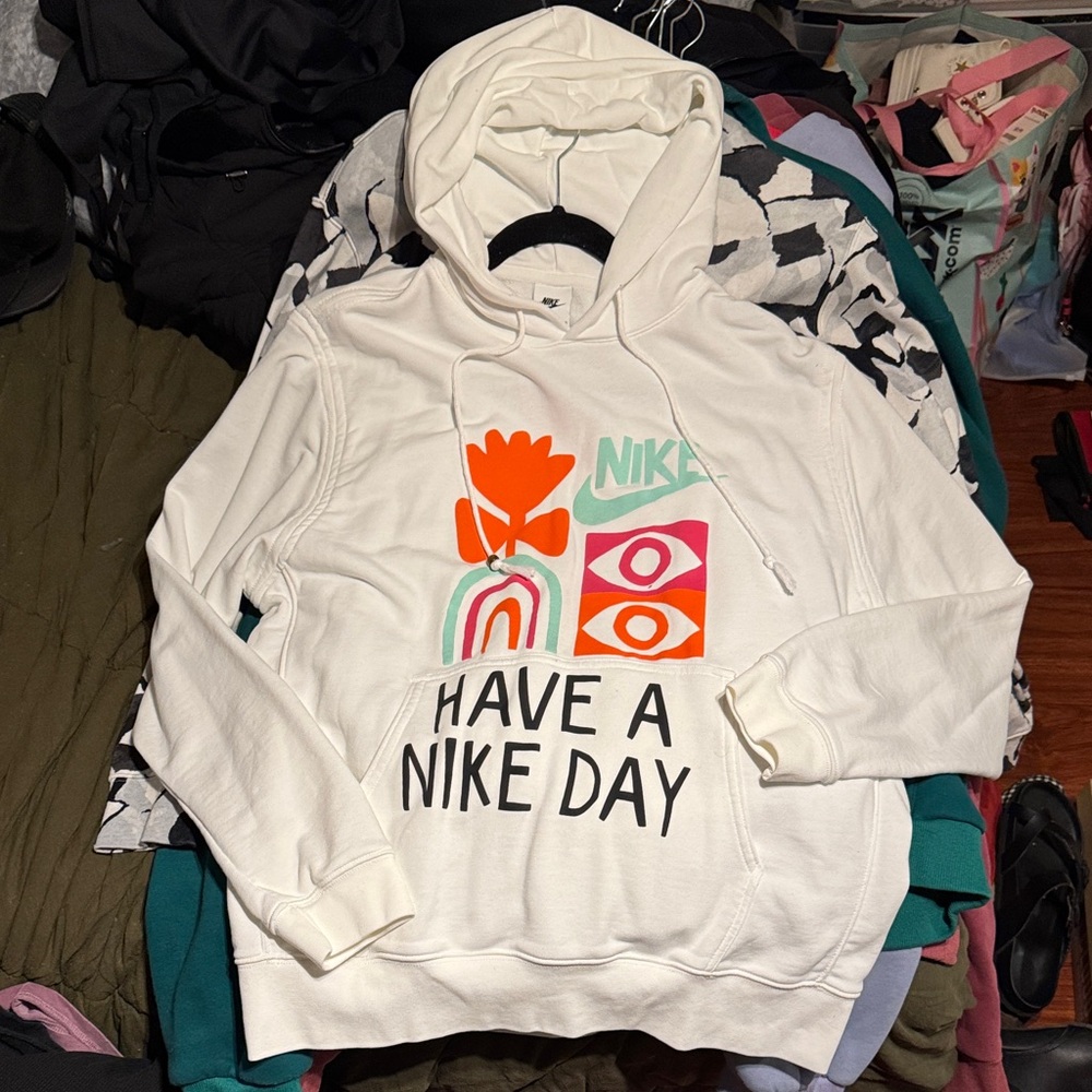 Nike women’s hoodie size LARGE. White with colorful graphic.